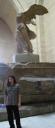 Posing by Victory of Samothrace