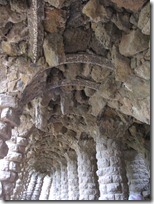 The ceiling of a walkway that looks like precarious rocks could fall at any moment.