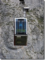 A cable car descending down the mountain.