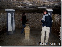 Jeff and Jen checking out one of the many careful arrangements of bones. It is estimated that over 6 million dead are interred here.