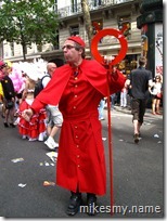 This guy had an ear bud in like security folks wear. Undercover gay pride officer?